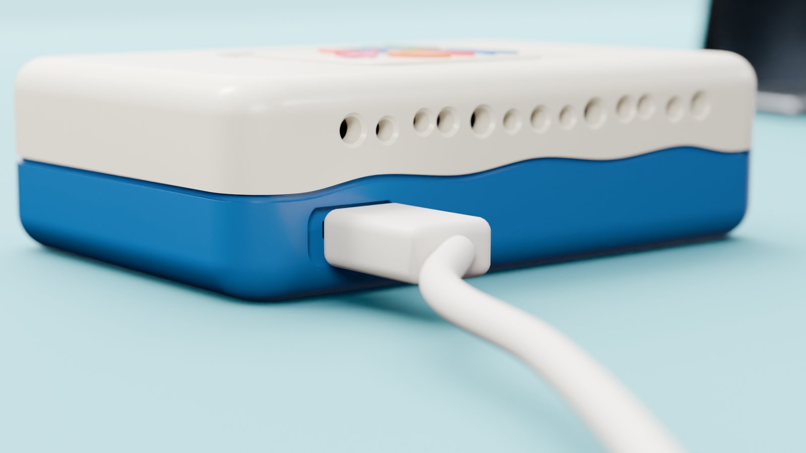 A cable seating into the power socket on the side of the box.